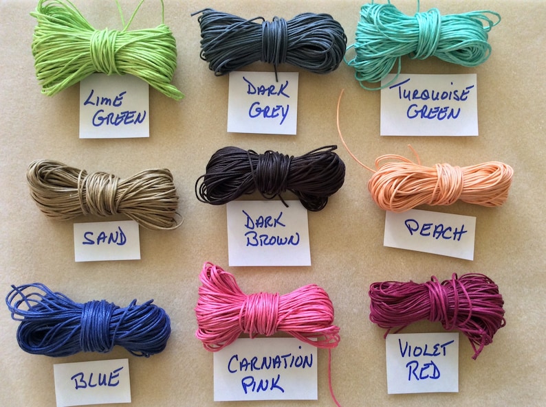 May include: Assortment of 10 spools of waxed cotton cord in various colors, including lime green, dark grey, turquoise green, sand, dark brown, peach, blue, carnation pink, and violet red.