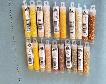 Cuentas TOHO tamaño 11/0, 9 gramos, diente de león, topacio claro, sol opaco, melocotón, beige lustroso, blanco navajo, arroz con leche, marfil claro, joyería