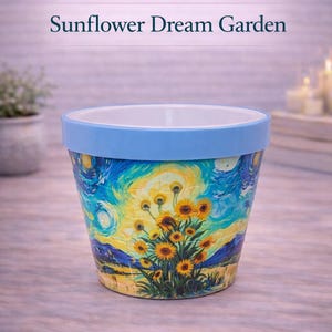 May include: A ceramic flower pot with a blue rim and a colorful painting of sunflowers and a starry night sky. The pot is labeled "Sunflower Dream Garden" and is part of the "BloomShape Puzzle Pot Series."