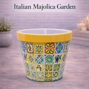 May include: A decorative ceramic flower pot with a yellow rim and a mosaic tile design. The pot features a variety of colorful patterns, including floral and geometric motifs. The text "BloomShape Puzzle Pot Series" and "Italian Majolica Garden" are displayed.