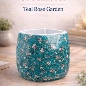 May include: A set of three ceramic mugs with a speckled, matte finish. The mugs are in shades of cream, light brown, and dark brown. Each mug has a simple, minimalist design, perfect for coffee or tea.