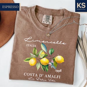 a t - shirt with a picture of lemons on it