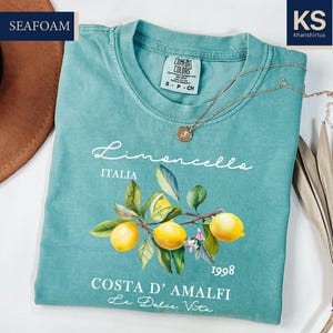 a t - shirt with a picture of lemons on it