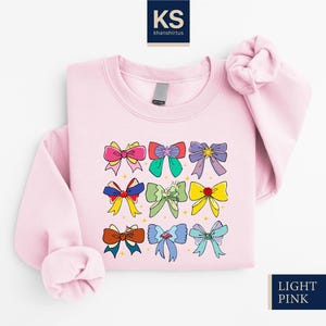 Disney Princess Cute Ribbons Sweatshirt, Disneyland Coquette Bow Shirt, Family Sweater, Tiana Aurora Ariel Cinderella Frozen Bella Rapunzel