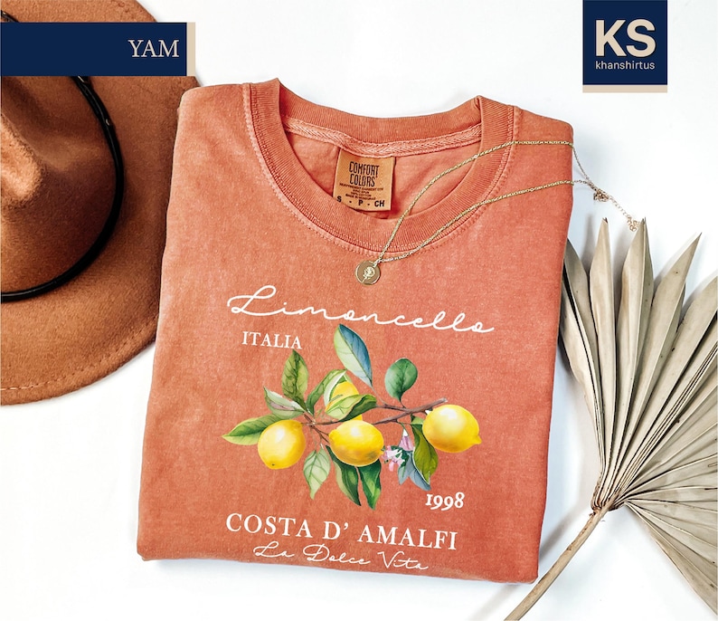 a t - shirt with a picture of two lemons on it