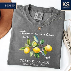 a t - shirt with a picture of lemons on it