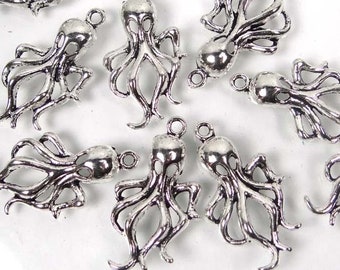 May include: A group of ten silver-toned octopus charms. Each charm has a detailed design of an octopus with eight tentacles.