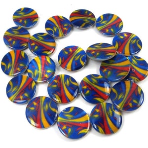 May include: A strand of round, blue, red, and yellow patterned beads. The beads are made of glass and have a glossy finish.