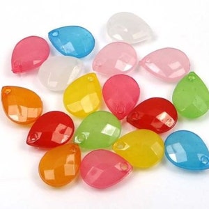May include: Assortment of colorful teardrop-shaped glass beads with a faceted design. The beads have a hole at the top for stringing.