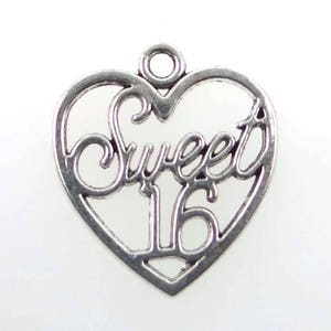 May include: Silver heart-shaped charm with the words "Sweet 16" in a decorative script.