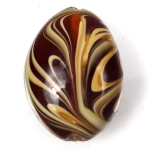 May include: A brown and cream marbled chocolate egg.
