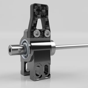 Könnte beinhalten: Eine schwarze und silberne mechanische Komponente mit einem Kohlefaserakzent. Die Komponente hat eine zylindrische Welle, die sich von einem Gehäuse mit einem Lager und zwei Schrauben erstreckt. Das Design ist industriell und technisch.