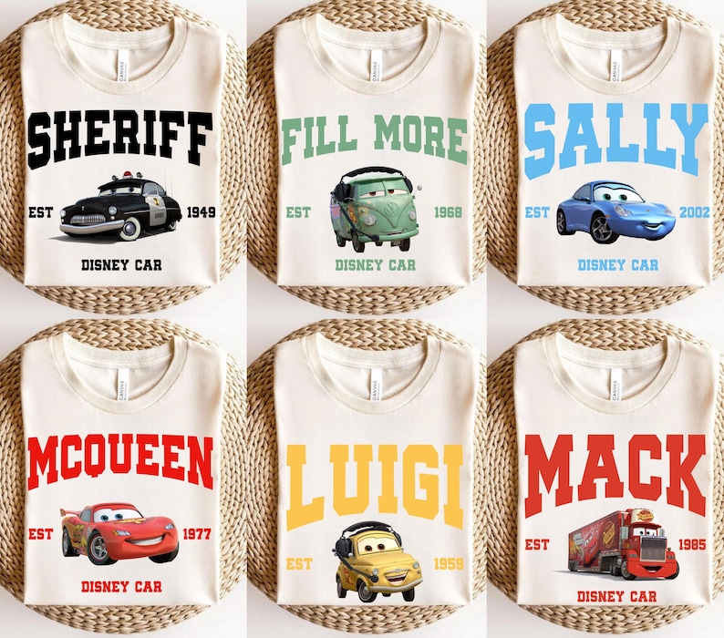 May include: Six white t-shirts with different Disney Cars characters and names printed on them. The shirts feature the characters Sheriff, Fill More, Sally, McQueen, Luigi, and Mack. Each shirt has the text "Disney Car" and the year the character was introduced.