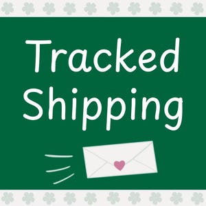 May include: Green chalkboard with white text that says "Tracked Shipping". A white envelope with a pink heart is flying off the chalkboard.