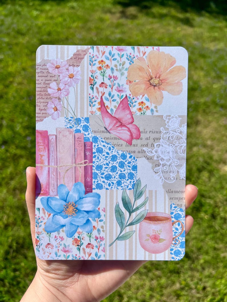 May include: A colorful notebook cover with a patchwork design featuring flowers, butterflies, books, and a teacup. The cover has a vintage aesthetic with a lace trim and handwritten text.