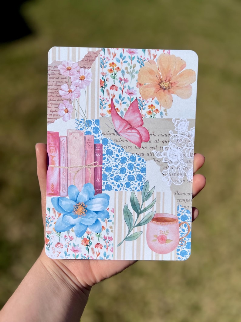 May include: A collage style notebook cover with a pink butterfly, flowers, a cup of tea, and books. The background is a patchwork of floral patterns, stripes, and text.