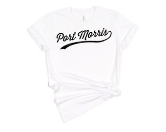 May include: White t-shirt with a black vintage-style graphic that says "Port Morris".