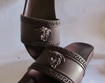 Versace Palazzo Men's Brown Rubber Medusa Head Sliders. Size U.S. 9.5. First Production. Rarely Worn. In Excellent Condition.