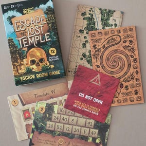 May include: A board game box titled "Escape from the Lost Temple" with a skull graphic, surrounded by puzzle cards. The cards include maps, instructions, and a red envelope that says "Do Not Open".