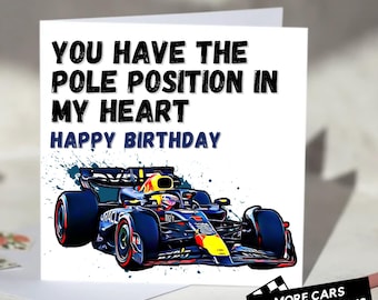 May include: A birthday card with a Formula 1 race car illustration. The card reads "You Have The Pole Position In My Heart Happy Birthday." The car is red, blue, and yellow. The card also has the text "MORE CARS MORE OCCASIONS."