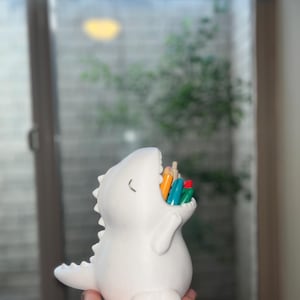 dinosaur pencil holder in various colors with fast shipping