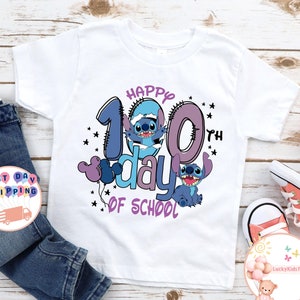 May include: White t-shirt with a blue and purple design featuring Stitch from Lilo & Stitch. The design says "Happy 100th day of school".