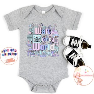 May include: A grey baby onesie with a colorful graphic of Walt Disney World landmarks and the text "Walt Disney World".