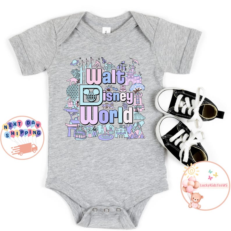May include: A grey baby onesie with a colorful graphic of Walt Disney World landmarks and the text "Walt Disney World".