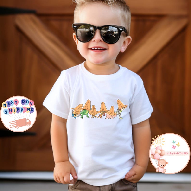 May include: A white ceramic mug with a black handle and the text "But First, Coffee" in a black, handwritten-style font. The mug is on a white surface.