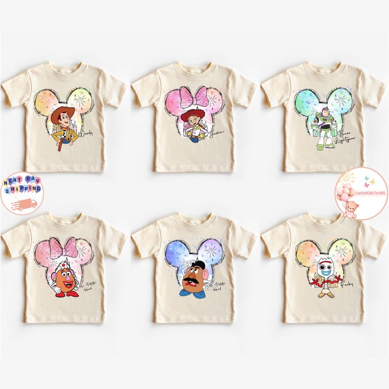 May include: Six beige t-shirts with different Disney characters printed on them. Each character is inside a Mickey Mouse ear silhouette with a watercolour background. The characters are Woody, Jessie, Buzz Lightyear, Mr. Potato Head, and  Rex. The shirts are all the same size and style.