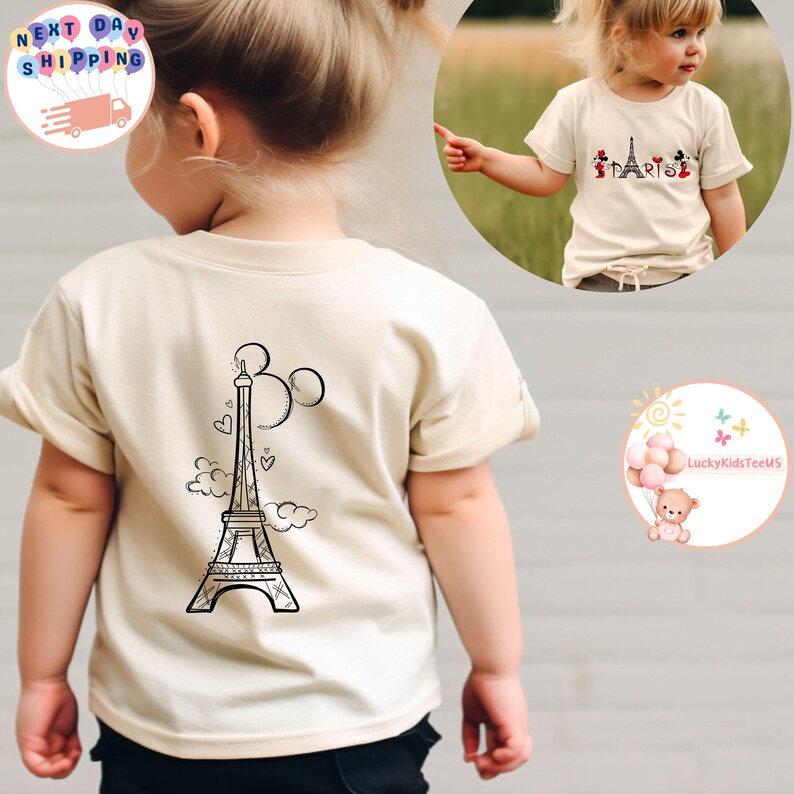 May include: A beige short-sleeved t-shirt with a black and white illustration of the Eiffel Tower and Mickey Mouse ears on the back. The front of the shirt has a black and white illustration of Mickey Mouse, Minnie Mouse, Donald Duck, and Goofy in front of the Eiffel Tower with the word "Paris" written below.
