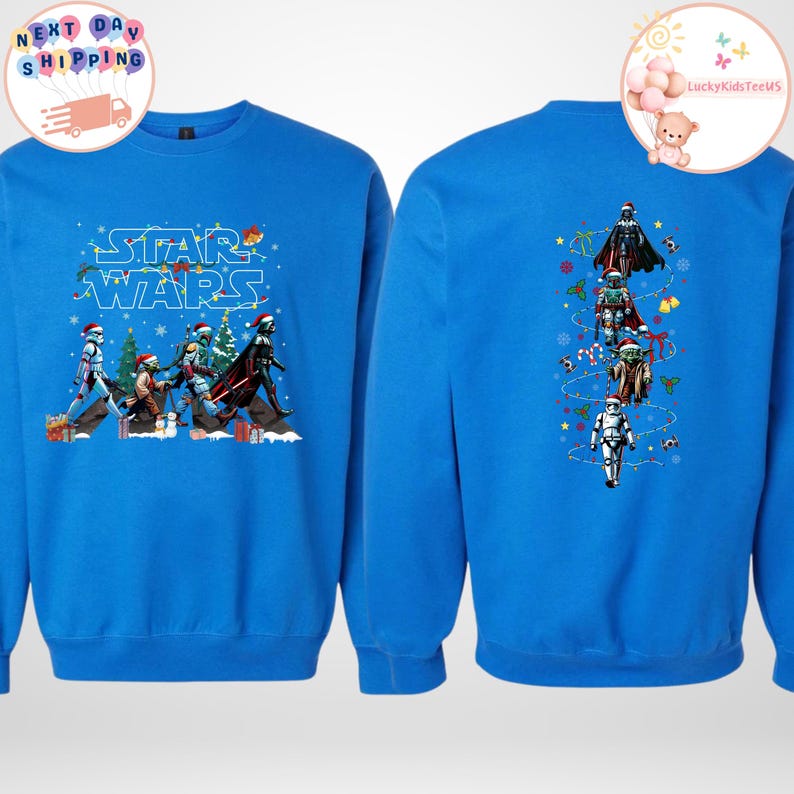 May include: A blue sweatshirt with a Star Wars Christmas design. The front has characters in Santa hats, with "Star Wars" in a festive font. The back shows a vertical arrangement of characters with Christmas decorations.