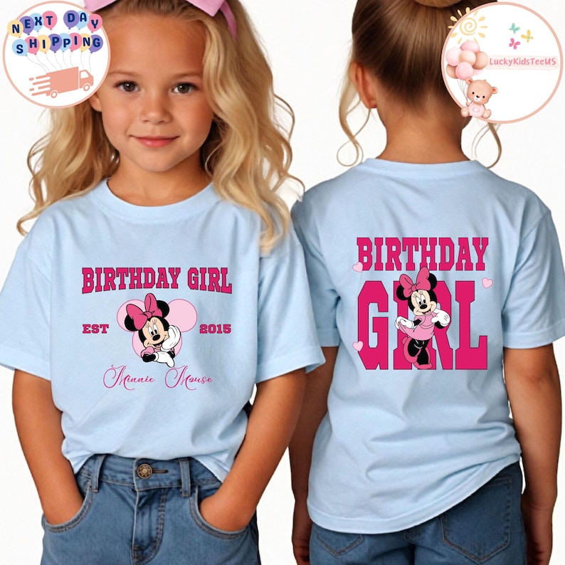 May include: Light blue t-shirt with a pink Minnie Mouse graphic and the text "Birthday Girl" on the front. The back of the shirt has the text "Birthday Girl" in pink with a Minnie Mouse graphic.