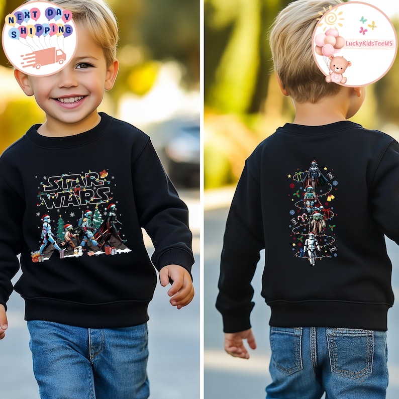 May include: Black Star Wars sweatshirt with a festive design on the front and back. The front features characters and the text "STAR WARS" with Christmas lights. The back has a vertical design of characters with lights and snowflakes.