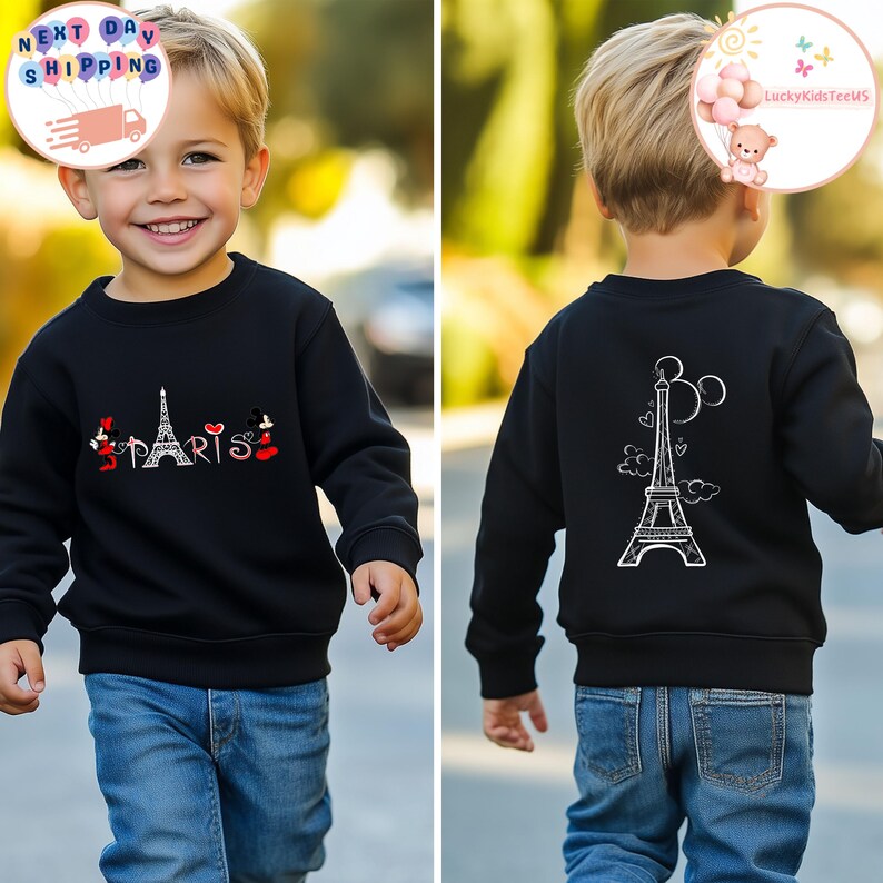 May include: Black sweatshirt with a white Eiffel Tower design on the back and a red "Paris" design with Mickey Mouse characters on the front.