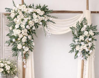 Wedding arrangement decorated with greenery and white roses, wedding arch decoration.