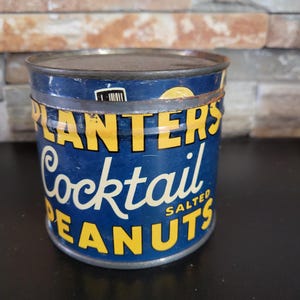vintage planters peanuts tin can
