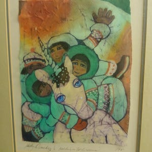 May include: Framed artwork featuring a group of figures in teal and white winter clothing, gathered around a unicorn. The background has orange and green hues, with a sun-like shape at the top. The artwork is signed and dated 1981.