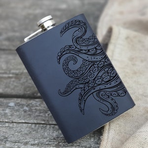 May include: A black metal flask with a silver cap and an engraved design of an octopus tentacle.