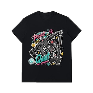 May include: A black t-shirt featuring a graphic print of two firearms with cartoon eyes. The text "Peace and Quiet" is written in pink and teal. The design includes colourful accents like stars, lightning bolts, and peace signs on a black background.