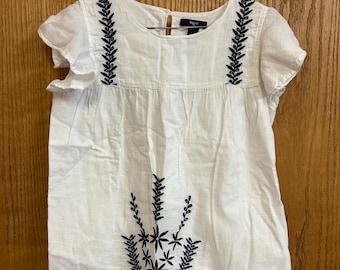 Girls folk blouse. All cotton, with polyester embroidery.
