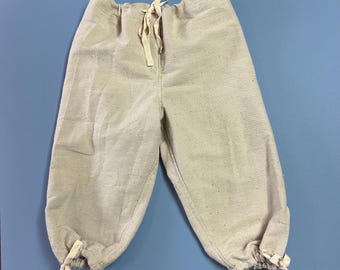 Boys knickers, or breeches. Medium. 60% cotton the rest is polyester. Coarse weave.