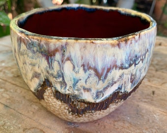 ceramic bowl in deep red and drippy glazes