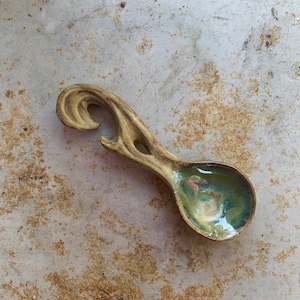 green ceramic serving spoon