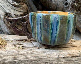 striped coffee mug in blue/green/yellow