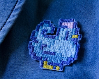 Cucire/applicare con il ferro da stiro il pollo blu/marrone di Stardew Valley. Adatto ai vegani.