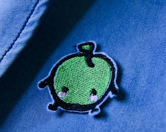 Cuci/stira Stardew Valley Junimo in verde, blu e viola, adatto ai vegani