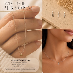 May include: Gold-toned initial pendant necklaces. The image shows the letter "R" on a gold chain, and the letter "J" on a silver chain. The text "MADE TO BE PERSONAL" is at the top. The average pendant size is 14.5mm total length, 8mm letter height, and 8.5mm width.