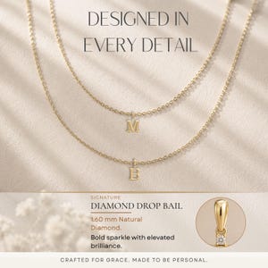 May include: Two delicate gold necklaces with letter pendants, one with an "M" and the other with a "B". The image includes text that reads "DESIGNED IN EVERY DETAIL" and "DIAMOND DROP BAIL". A small diamond is featured.