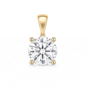 May include: A round brilliant cut clear gemstone pendant set in a four-prong yellow gold mounting. The pendant features a smooth, tapered yellow gold bail at the top, designed to hold a chain, with the stone centered in the gold setting.